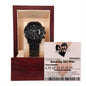 The "To Husband, Jackpot Winner - Metal Chronograph Watch" with a sleek black design is elegantly displayed in an open wooden case. Next to the case, there's a novelty "Love Lottery" ticket featuring the prize description: "Smoking Hot Wife," along with cheeky instructions on love. The luxurious copper dial adds an extra touch of elegance.