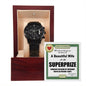 Displayed inside a wooden gift box, the "To Husband, SuperPrize - Metal Chronograph Watch" features a black chronograph design with a luxury copper dial. The interior lid includes a message card that congratulates the husband and lovingly refers to his wife as a "beautiful wife for life" and his "superprize.