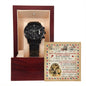 A black To Husband, Great Father - Metal Chronograph Watch with a copper dial is displayed in an open wooden box lined with beige fabric. Behind the watch, an illustrated card with text is positioned upright within the box.