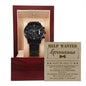 A "To Groomsman, Help Wanted - Metal Chronograph Watch" is displayed in an open wooden box. Inside the lid, a card reads "HELP WANTED Groomsman" with some text below it. The box has a beige interior.