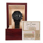 A black metal chronograph watch with a luxury copper dial comes in a red wooden box. Inside the lid, there's a small card labeled "Love Coupon" from the "To Husband, Coupon Book - Metal Chronograph Watch.