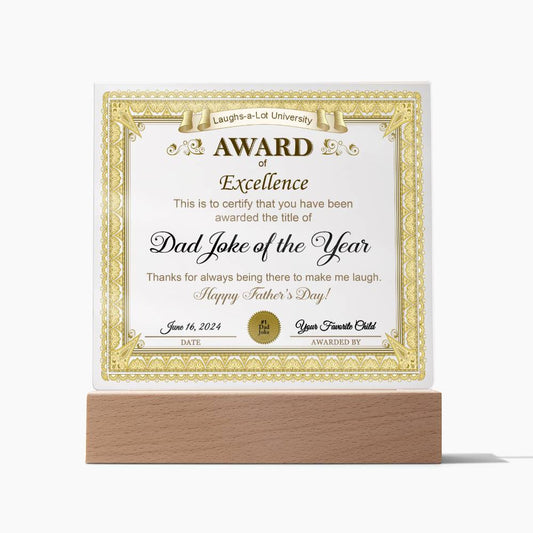 A unique and sentimental gift, a certificate titled "Award of Excellence," is displayed on an LED wooden base. Recognizing someone for the "Dad Joke of the Year" with details dated June 16, 2024, and a heartfelt message for Father's Day, this "To Dad, Award of Excellence - Acrylic Square Plaque" shines brightly.