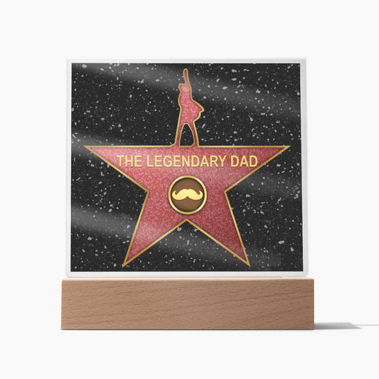 A unique gift, this acrylic plaque on a wooden base features a star design with the text "To Dad, The Legendary Dad - Acrylic Square Plaque" and an icon of a mustache in the center.