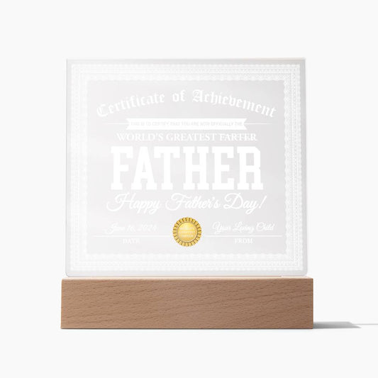 A square acrylic plaque on an LED wooden base reads "To Dad, World's Greatest Farter - Acrylic Square Plaque" with space for a date and from signature, making it a unique and sentimental gift.