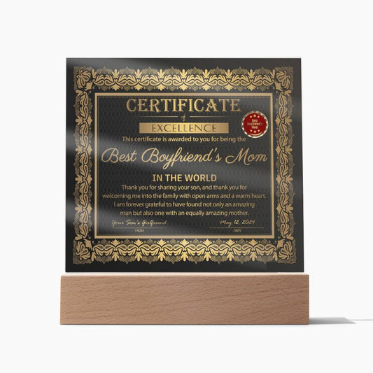 A decorative "To Boyfriend's Mom-Certificate of Excellence - Acrylic Square Plaque" on an LED wooden base, featuring ornate golden borders and a red seal.