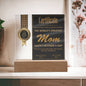 A mother's day certificate in a frame with a gold seal, labeled "world's greatest mom" on an LED wooden base, dated May 12, 2024.