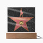 A unique gift, this acrylic plaque on a wooden base features a star design with the text "To Dad, The Legendary Dad - Acrylic Square Plaque" and an icon of a mustache in the center.