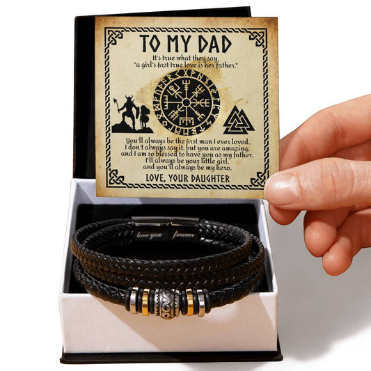 A hand holding a sentimental plaque with a father-daughter message, beside a box containing the "To Dad, First True Love" Bracelet.