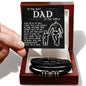 A hand presenting an open gift box containing the To Dad, By My Side - Love You Forever Bracelet and a card with a heartfelt message for 'the best dad in the world'.