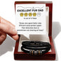 A hand holds a card rating "EXCELLENT FUR DAD: 4 out of 5 Paws." The card praises belly rubs and poop picking but notes a paw deduction for not sharing all food. Below, a To Fur Dad, Sharing All Food - Love You Forever Bracelet completes the picture.