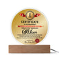 The "To Mom, World's Most Marvelous Mom" acrylic circle plaque on a wooden base reads "Certificate of Achievement: World's Most Marvelous Mom," awarded by "Your loving child"—a perfect gift to cherish.
