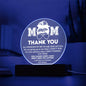 A glowing purple circular LED lamp with the inscription "mom thank you" and a heartfelt message of appreciation, displayed on the To Mom, Standing By Me - Acrylic Circle Plaque set on a wooden base.
