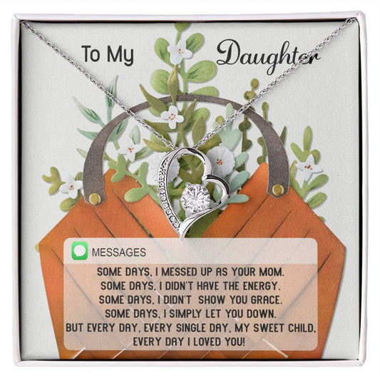 The Daughter-Show You Grace - Forever Love Necklace, adorned with a heart-shaped pendant and a diamond center, is beautifully displayed on a floral card that honors the bond between mother and daughter. Its gold finish enhances the elegance of this treasured keepsake.