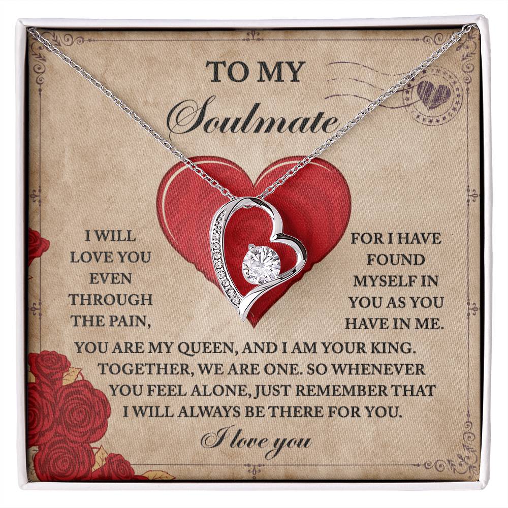 The Soulmate-Found Myself Forever Love Necklace features a heart-shaped pendant that sparkles on a romantic backdrop. Surrounded by roses and a large red heart, it is beautifully highlighted with CZ crystals and a dazzling gold finish.
