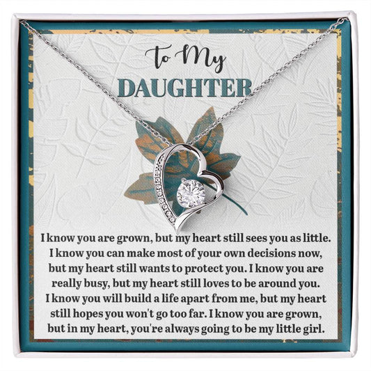 The "Daughter-Go Too Far - Forever Love Necklace" features a heart-shaped design with a dazzling CZ crystal and comes with a card that shares a touching message from a parent to their daughter, conveying love and hope. With its elegant white gold finish, this necklace is a timeless keepsake that speaks volumes.