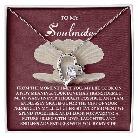 The Soulmate-Every Moment - Forever Love Necklace has a heart-shaped pendant with shimmering cubic zirconia on a vibrant red background, paired with a heartfelt love and gratitude message. It features an elegant gold finish.