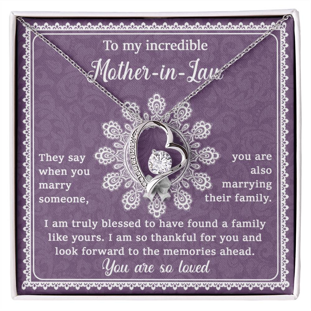 A gift box with a personalized jewelry piece, the "To Mother-In-Law, Family Like Yours - Forever Love Necklace," a pendant shaped like a heart and an engraved message on a purple background, dedicated to a mother-in-law.