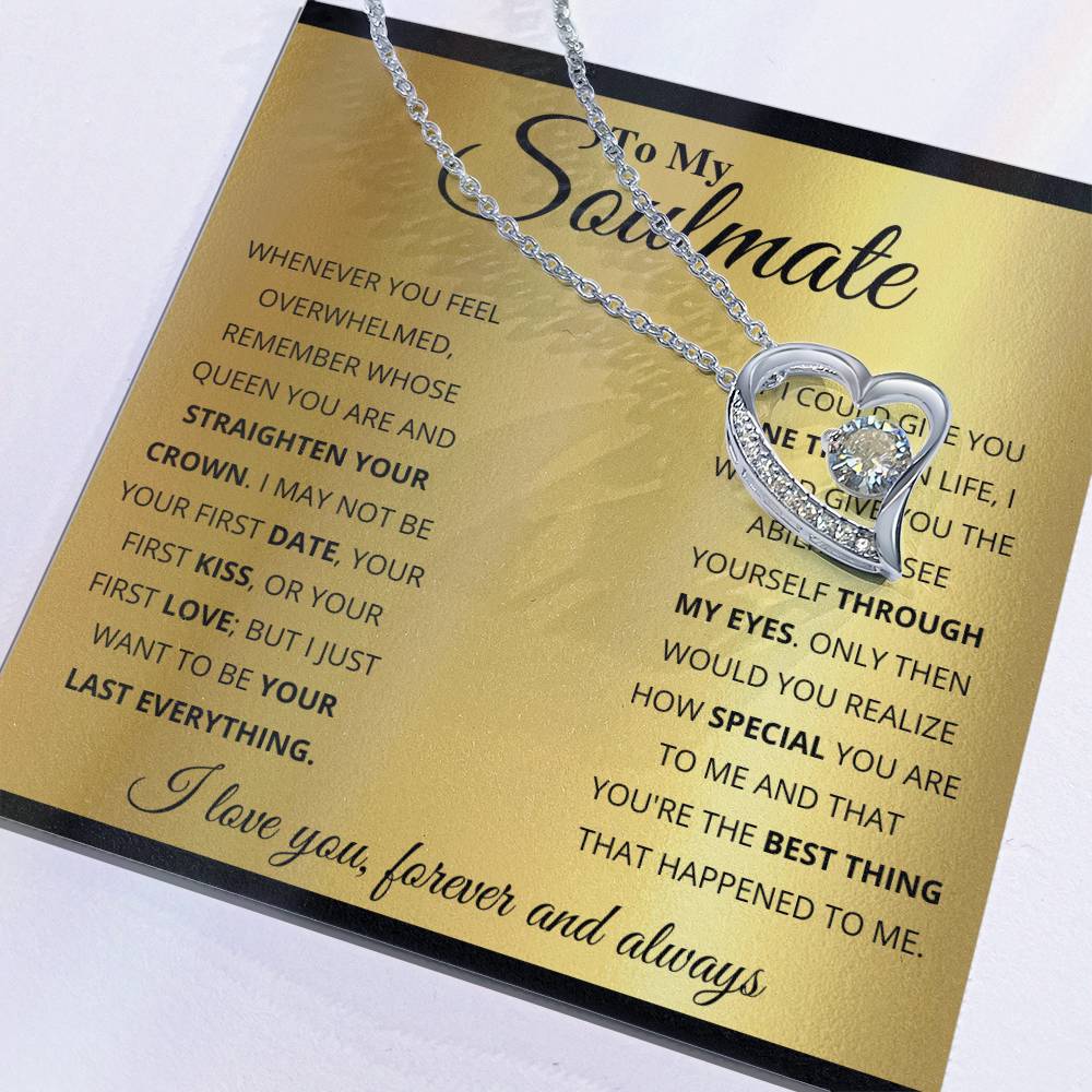 A ShineOn Fulfillment Forever Love Necklace with a heart-shaped pendant resting on a card with a sentimental message to a soulmate.