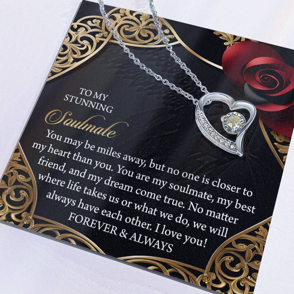 The Soulmate-Have Each Other - Forever Love Necklace features a heart-shaped pendant with a white gold finish and CZ crystal accents. It is presented on a card with romantic gold and red rose designs, featuring a sentimental message to your soulmate.