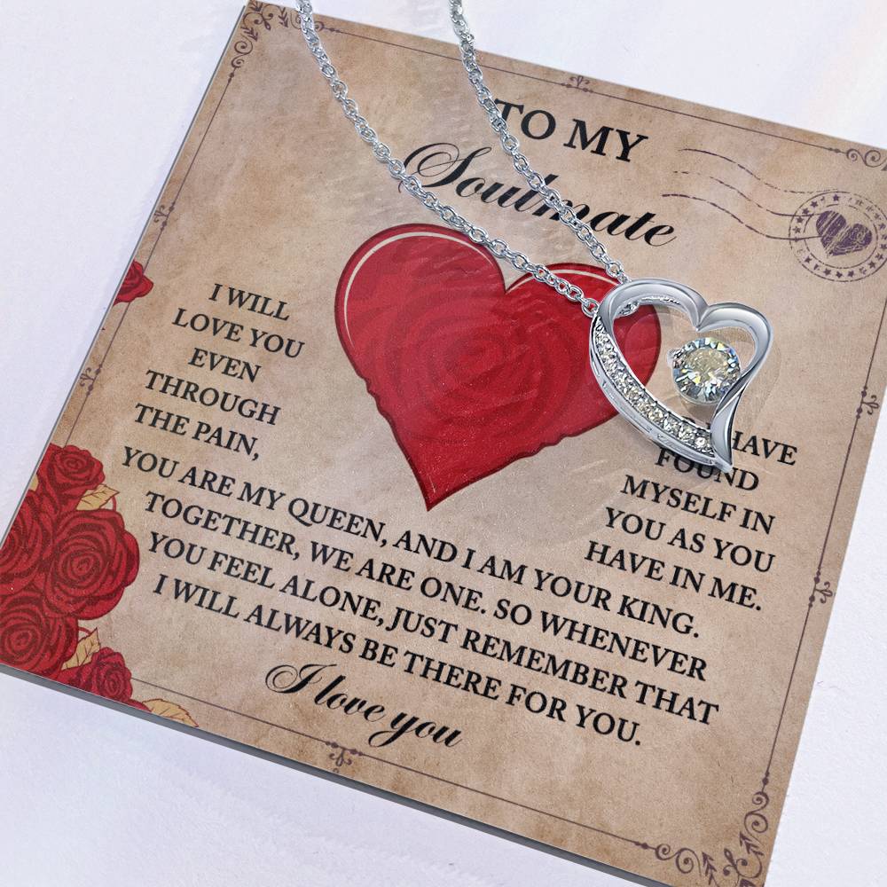 The Soulmate-Found Myself - Forever Love Necklace features a heart-shaped pendant delicately resting on a letter with a romantic message, showcasing an elegant gold finish and shimmering cubic zirconia that capture timeless devotion.