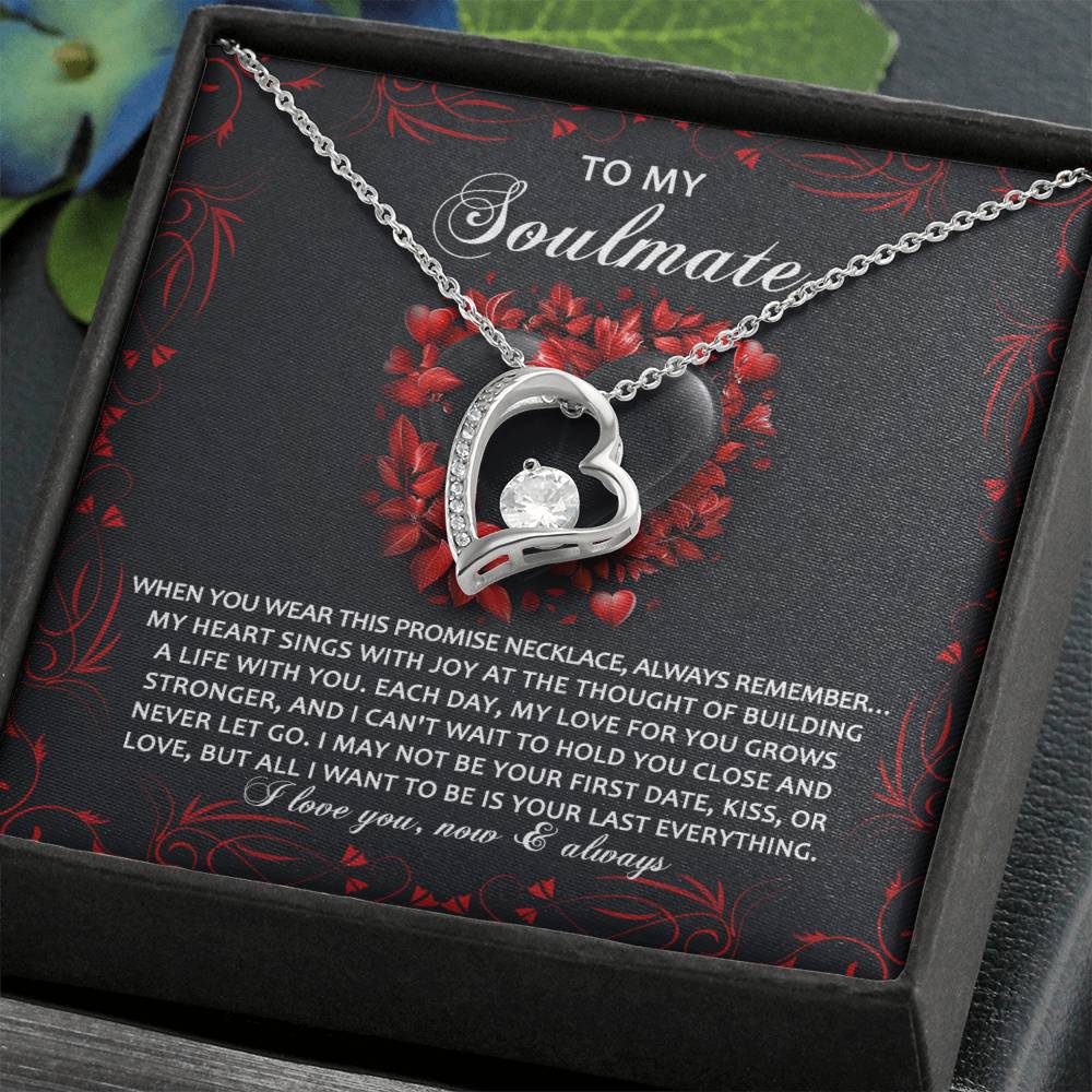 The Soulmate-Hold You Close - Forever Love Necklace showcases a heart-shaped pendant with a sparkling cubic zirconia crystal. Presented in an elegant box, it includes a heartfelt note of love and commitment, all highlighted by its luxurious gold finish.