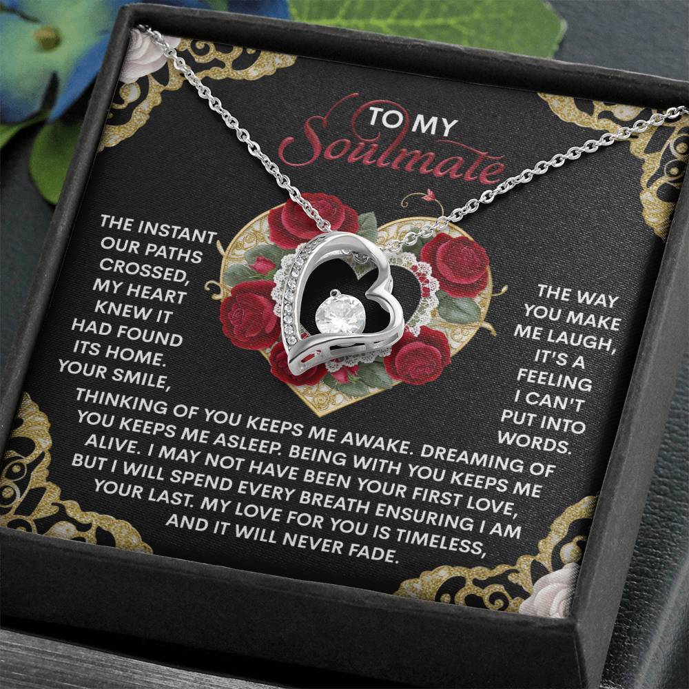 The Soulmate-Never Fade - Forever Love Necklace features a heart-shaped pendant with a CZ crystal on a silver chain. It comes in a box with a floral heart and "To My Soulmate" message, finished elegantly in white gold, ideal for expressing timeless love.