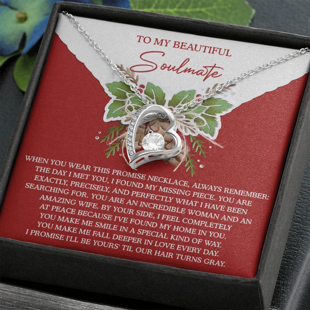 The Soulmate-At Peace - Forever Love Necklace is a heart-shaped piece presented on a card embellished with floral graphics and an emotional message for your soulmate. Featuring a stunning CZ crystal and white gold finish, it's the perfect token of eternal affection.