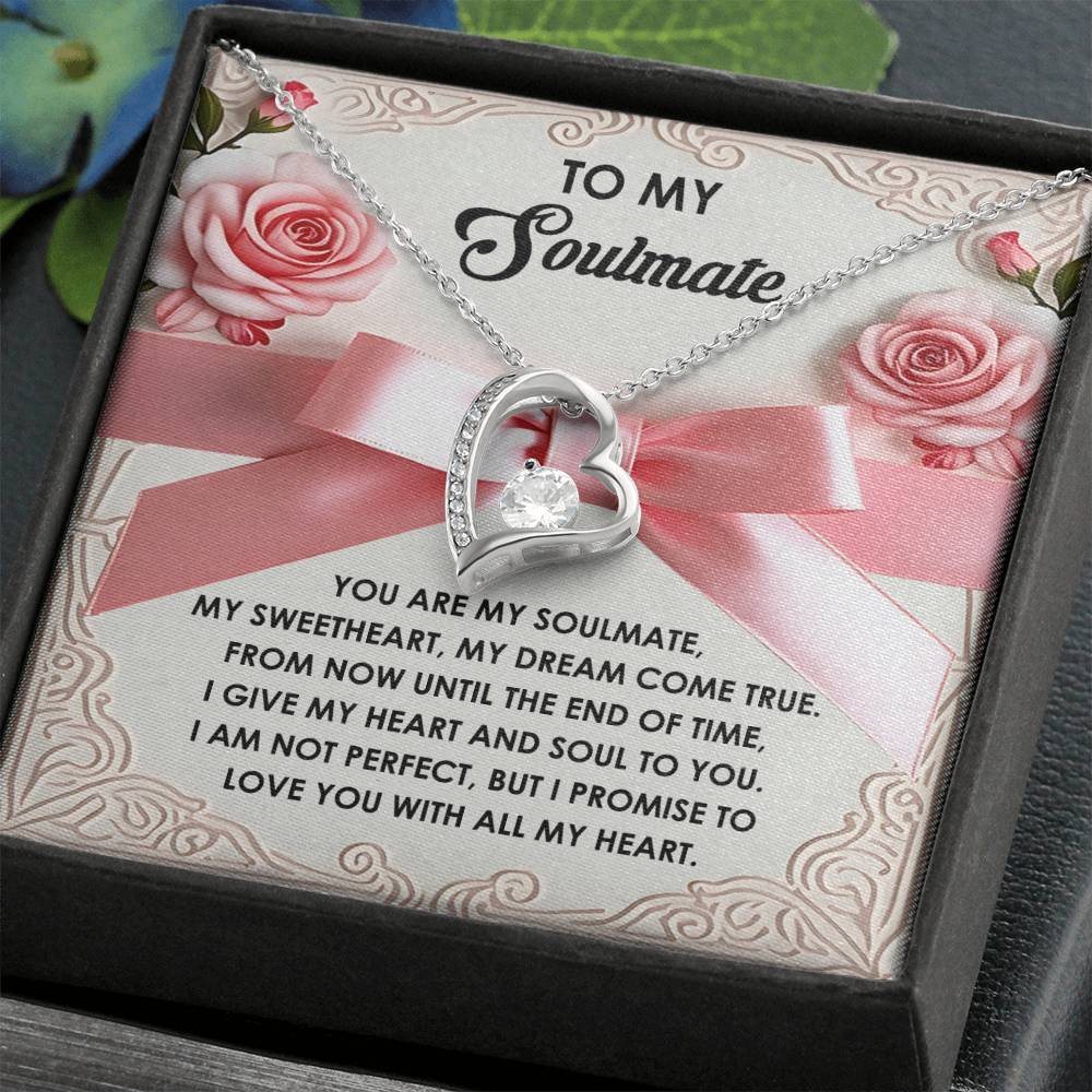The Soulmate-Heart And Soul - Forever Love Necklace features a heart shape with a central CZ crystal in a gift box. Inside, the card reads: "To my soulmate, my sweetheart, my dream come true. I give you my heart and soul to you. I am not perfect, but I love you." Elegantly gold finished for timeless charm.