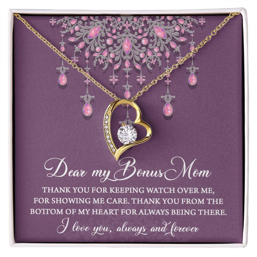 The "To Bonus Mom, Always Being There - Forever Love Necklace" is displayed in a box, featuring a heart-shaped design with a diamond pendant. The background includes text expressing appreciation for a "bonus mom," adorned with a decorative floral design at the top. This elegant piece showcases a stunning 6.5mm CZ crystal as its centerpiece.