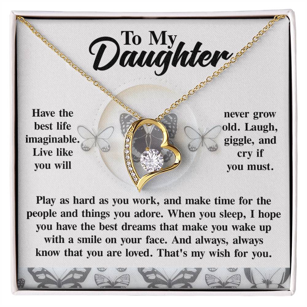 The Daughter-My Wish - Forever Love Necklace boasts a gold heart pendant with a CZ crystal center, accompanied by a heartfelt message for your daughter, embellished with butterfly illustrations and enhanced by a white gold finish.