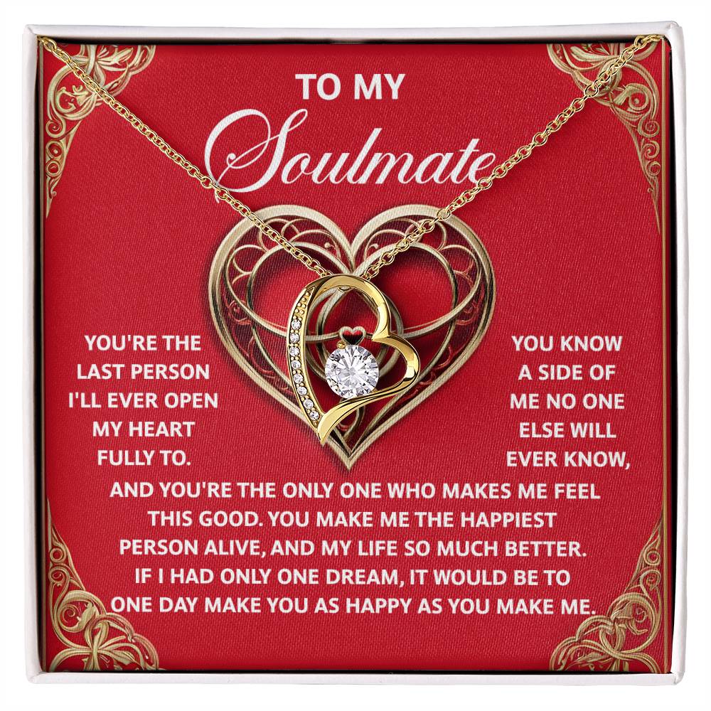 The "Soulmate-The Only One - Forever Love Necklace" showcases a heart-shaped pendant with a dazzling CZ crystal at its center, set on a red background. With a gold finish and accompanying soulmate message, it's an ideal symbol of eternal love.