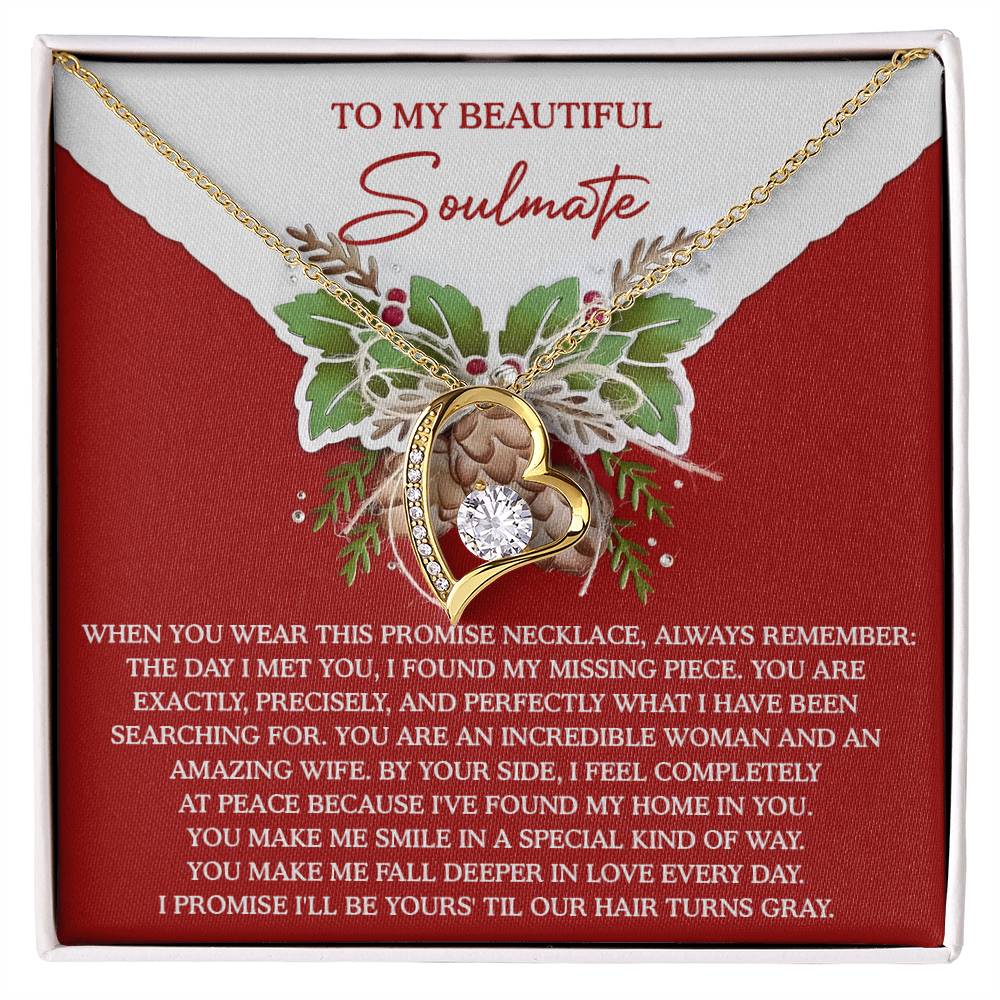 The Soulmate-At Peace - Forever Love Necklace, featuring a gold finish, showcases a pendant with a crystal heart adorned with rose details. It is elegantly presented on a red card that conveys a romantic message to your soulmate.