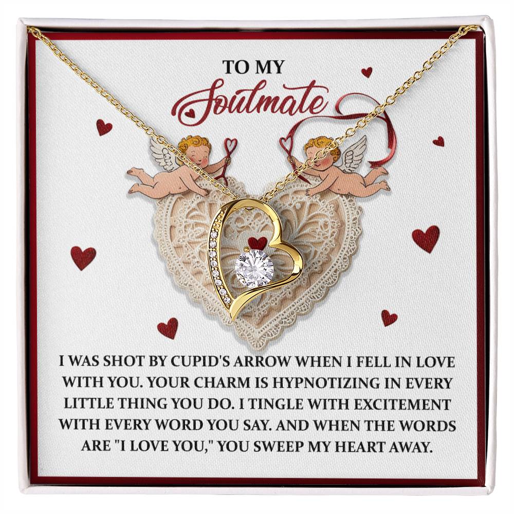 The Soulmate-Sweep My Heart - Forever Love Necklace, featuring a heart-shaped CZ crystal, comes with a card reading "To My Soulmate," surrounded by cherubs and hearts. Its elegant gold finish makes it an everlasting keepsake of love and admiration.