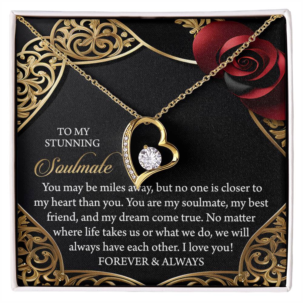 The Soulmate-Have Each Other - Forever Love Necklace showcases a gold heart pendant with a brilliant cubic zirconia stone, set against a rose-decorated background. It's dedicated to your soulmate, symbolizing eternal love and closeness.