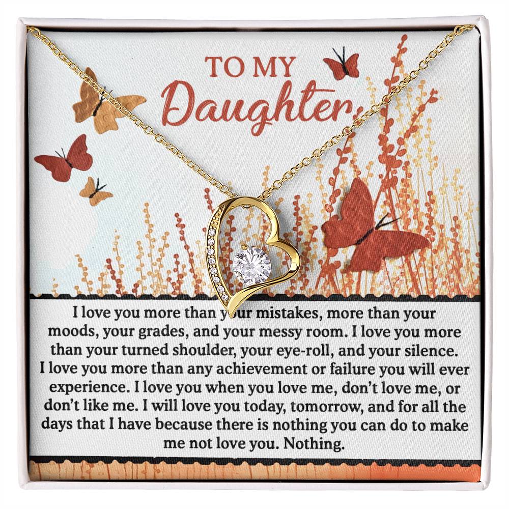 The Daughter-Love You More - Forever Love Necklace, featuring cubic zirconia and a striking gold finish, is beautifully displayed against a backdrop adorned with butterflies and a touching message to your daughter, conveying unconditional love.