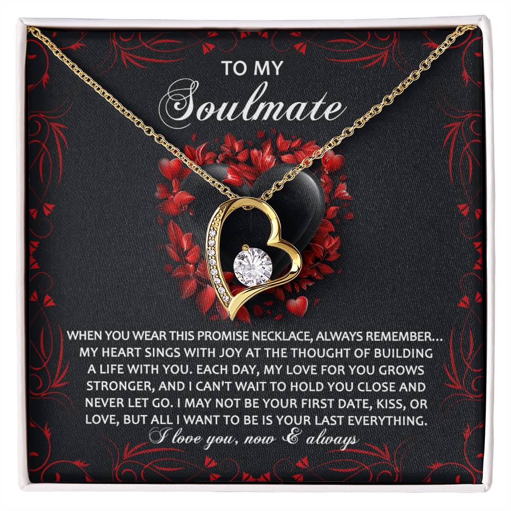 The Soulmate-Hold You Close - Forever Love Necklace includes a heart-shaped pendant with a cubic zirconia crystal and a lustrous gold finish, presented on an elegantly designed card featuring a romantic message with decorative red and black elements.