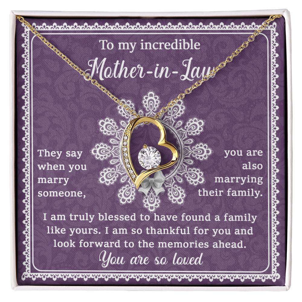 The "To Mother-In-Law, Family Like Yours - Forever Love Necklace" features a heart-shaped design with a diamond pendant set against a purple background. Crafted with a 14k white gold finish, this unique gift includes a heartfelt message for your mother-in-law, expressing gratitude and love.