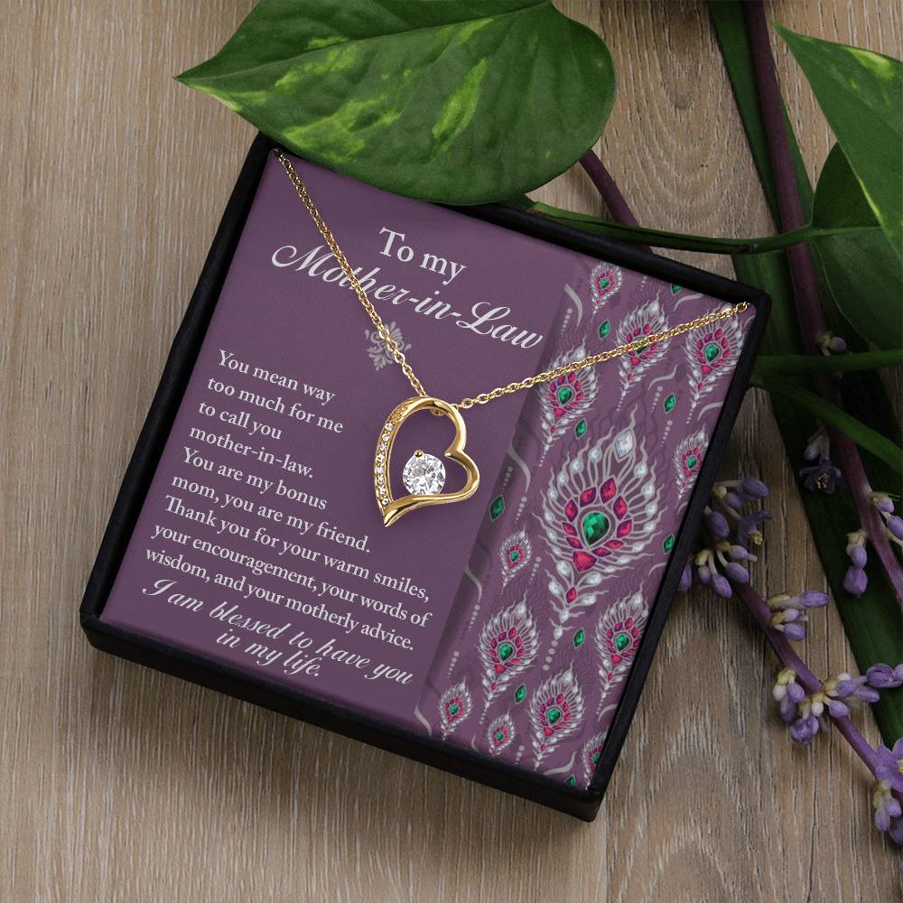 The "To Mother-In-Law, Words Of Wisdom - Forever Love Necklace" features a heart-shaped pendant set on a purple card addressed to "Mother-in-Law." The card, embellished with a floral-like pattern on the right side, is nestled inside an elegant black box.