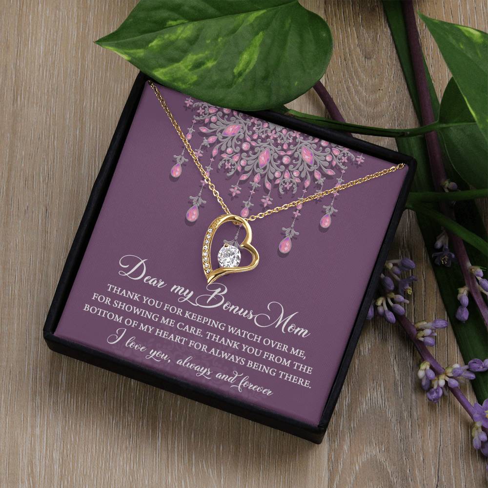 The "To Bonus Mom, Always Being There - Forever Love Necklace" is a heart-shaped pendant adorned with a 6.5mm CZ crystal in a white gold finish. It comes beautifully presented in a box featuring a heartfelt message for your "Bonus Mom," surrounded by delicate leaves and flowers.
