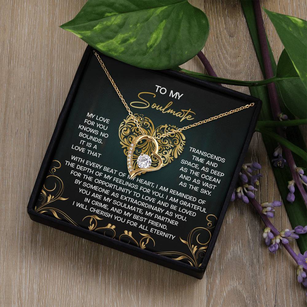 The Soulmate-The Sky - Forever Love Necklace is a gold heart-shaped piece with a silver pendant, set with CZ crystal accents among leaves and flowers. It comes in an ornate box inscribed with sentiments of devotion to a soulmate.
