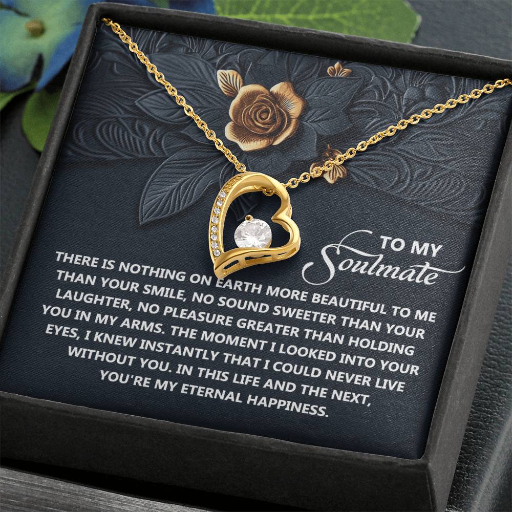 The Soulmate-Eternal Happiness - Forever Love Necklace features a heart-shaped pendant in white gold with CZ crystal on a floral-embossed card. The message "To My Soulmate" highlights its celebration of eternal affection.