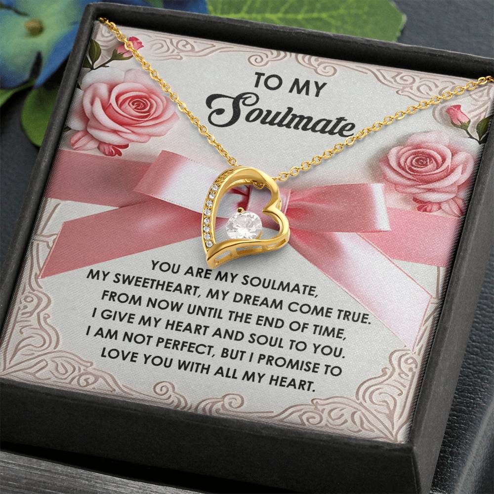 The Soulmate-Heart And Soul - Forever Love Necklace features a heart-shaped pendant with a stunning CZ crystal, beautifully packaged with roses and pink ribbon. It boasts a gold finish and includes a touching message for your soulmate.
