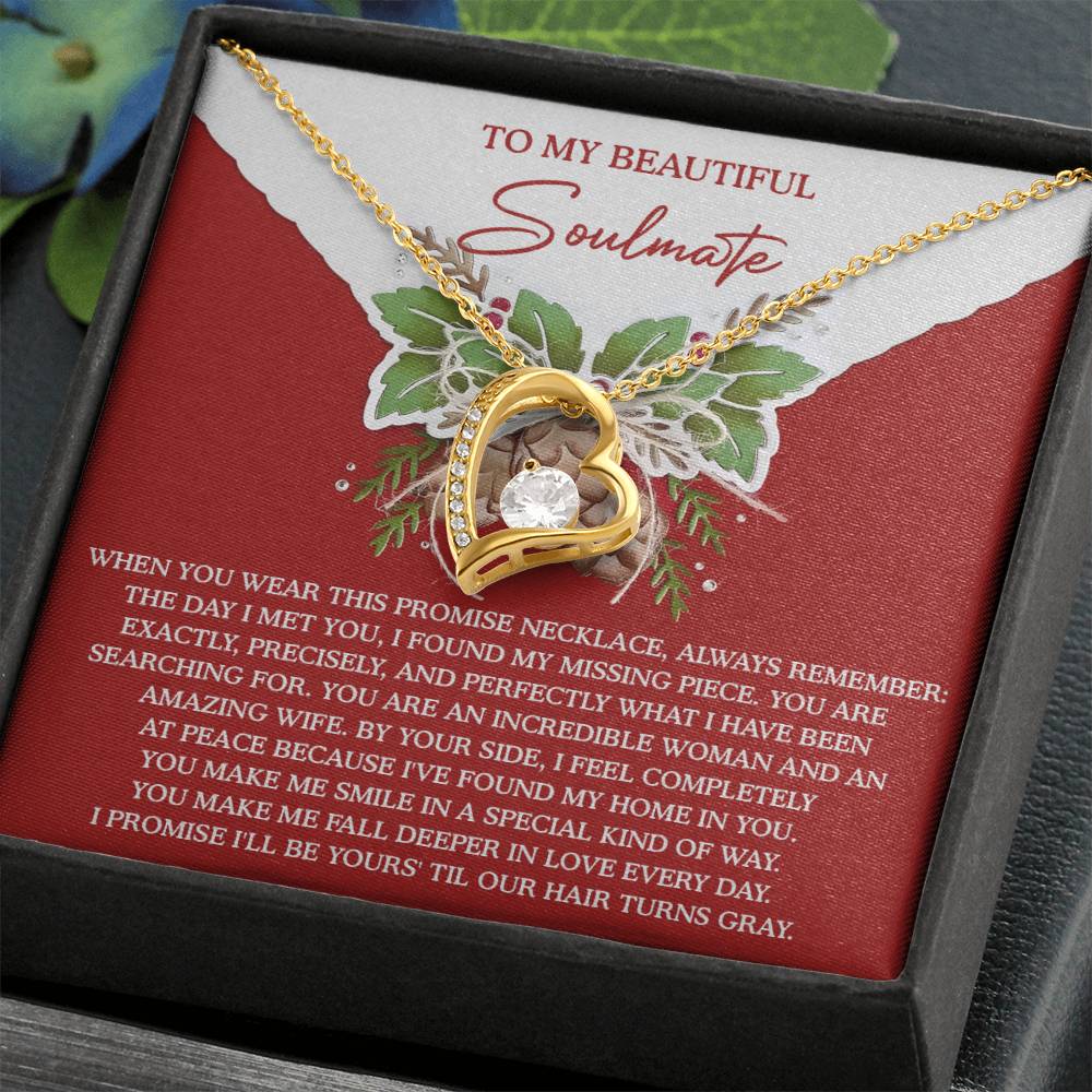 The Soulmate-At Peace - Forever Love Necklace features a gold heart-shaped pendant adorned with a CZ crystal centerpiece and a gold finish. It is elegantly presented on a card bearing the heartfelt message "To My Beautiful Soulmate," making it the perfect symbol of enduring affection.