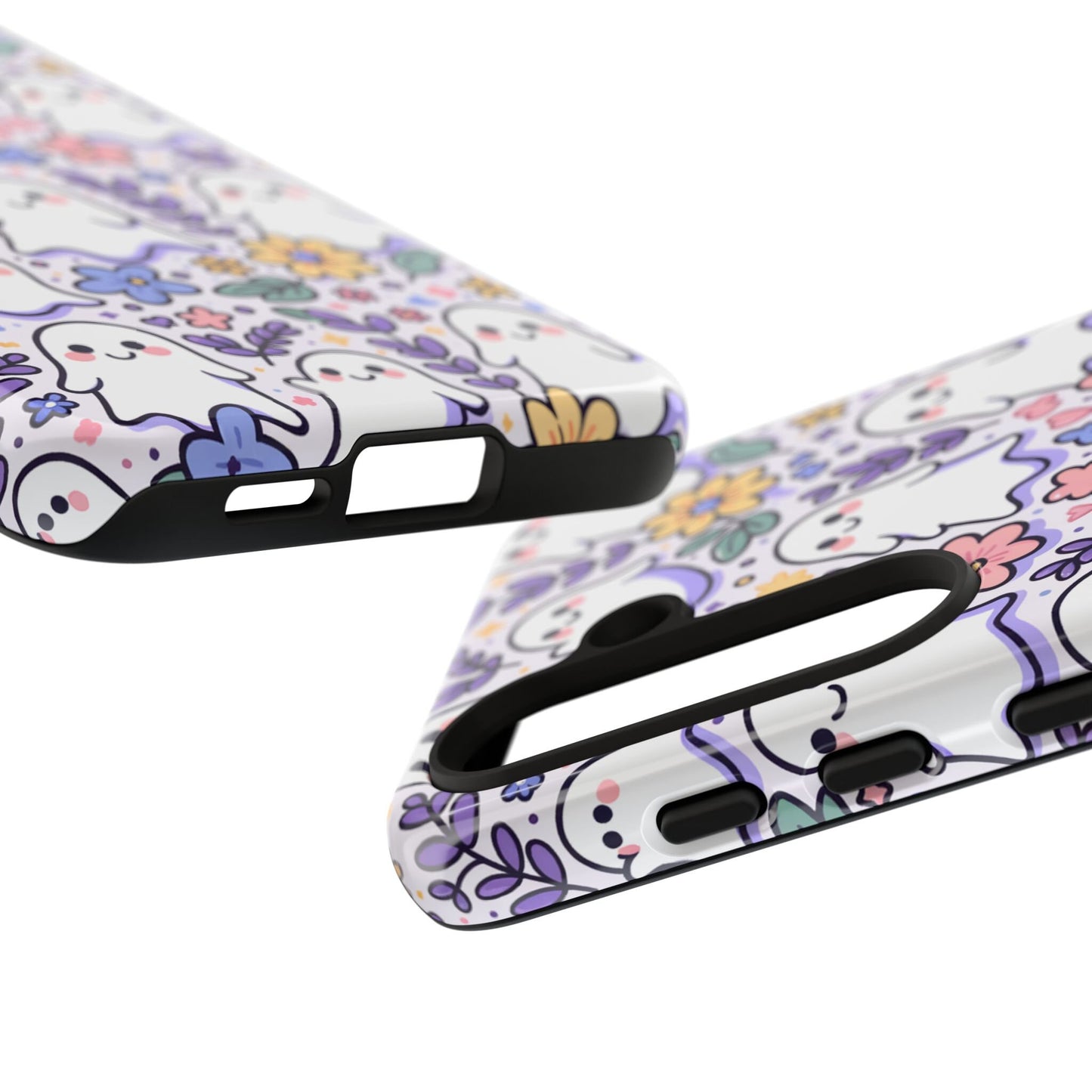 Close-up of two phone cases with colorful cartoon ghost and floral patterns, highlighting the Cute Ghosts And Flowers Phone Case, perfect for adding charm to your iPhone 15, 14, 13, Samsung Galaxy, or Pixel. An ideal Happy Halloween Gift for any Halloween lover!