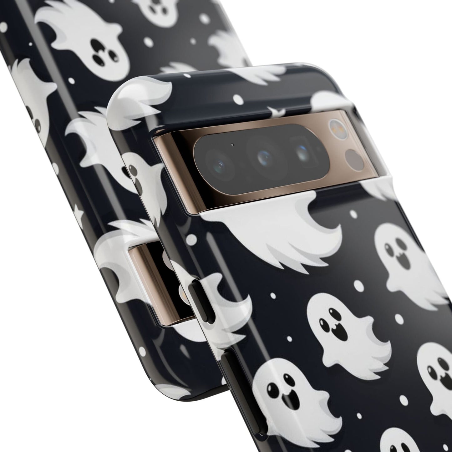 Close-up of two smartphones featuring the "Cute Little Ghosts Phone Case," which showcases an adorable pattern of white cartoon ghosts on a black background—an ideal Halloween gift for anyone who adores charming ghosts.