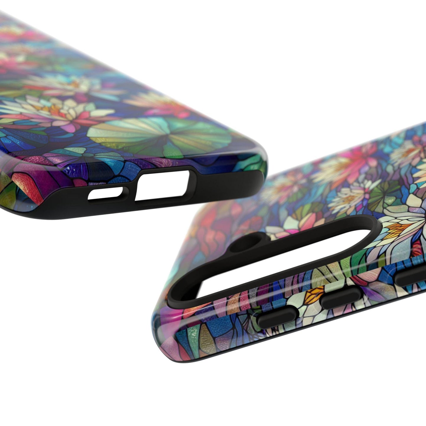 A close-up showcases two phone cases adorned with vibrant, floral designs. One case is displayed from the back, while the other is viewed from the side, emphasizing the detailed cutouts for buttons and ports, inspired by the July Birth Flower Water Lily Wildflower Stained Glass motifs.