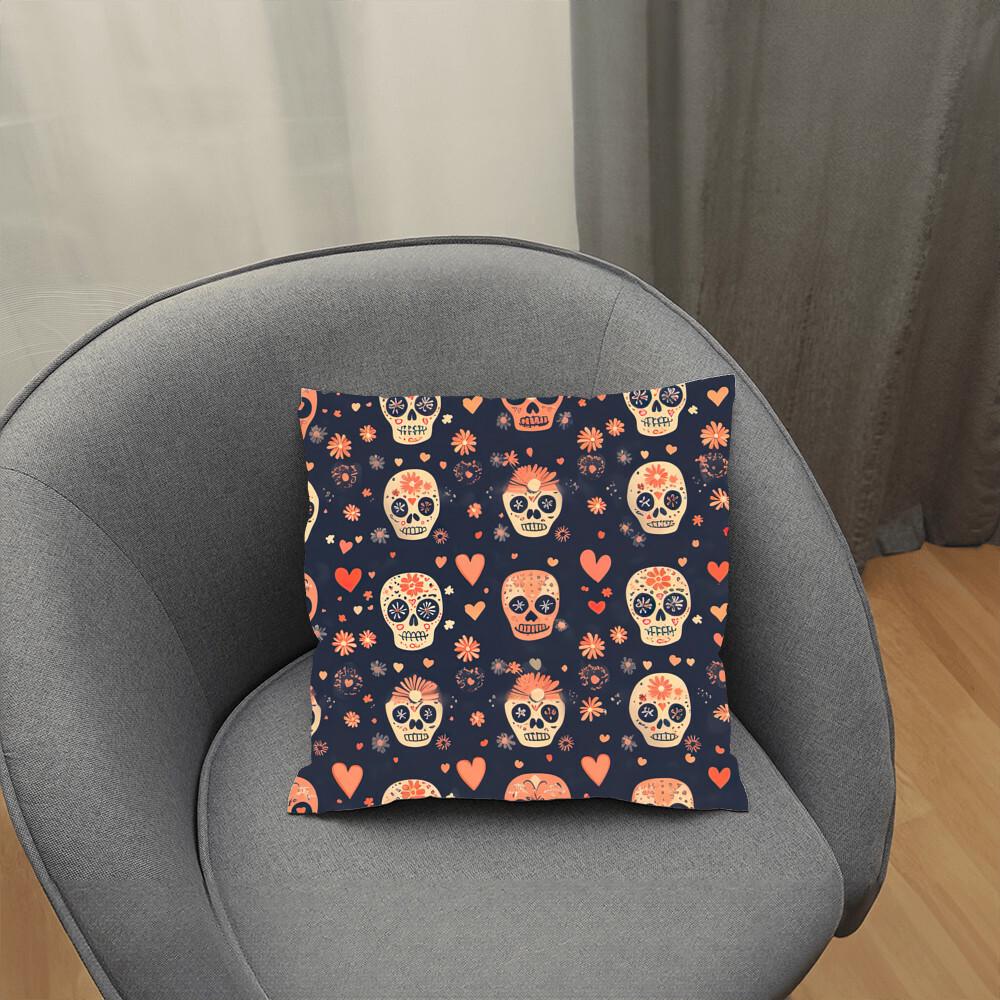 A gray chair features the Day of the Dead Mexican Skull Pillow, a vibrant cushion adorned with a colorful array of sugar skulls, hearts, and flowers set against a dark backdrop.