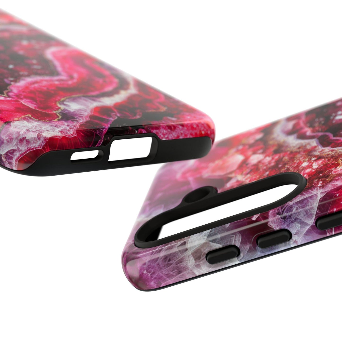 Displayed in a close-up shot, the July Birthstone Ruby Crystal Geode Design Phone Cases for iPhone 15 showcase vibrant abstract patterns in red and purple that resemble ruby crystal geodes. With precise cutouts for the camera and buttons, these cases perfectly merge style with functionality.