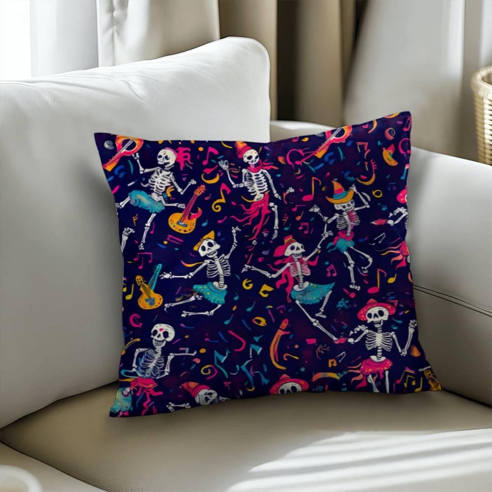 The Dancing Skeleton Pillow, a spooky decorative pillow adorned with a colorful pattern of dancing skeletons, musical notes, and guitars on a dark background, perfectly captures the Halloween spirit.