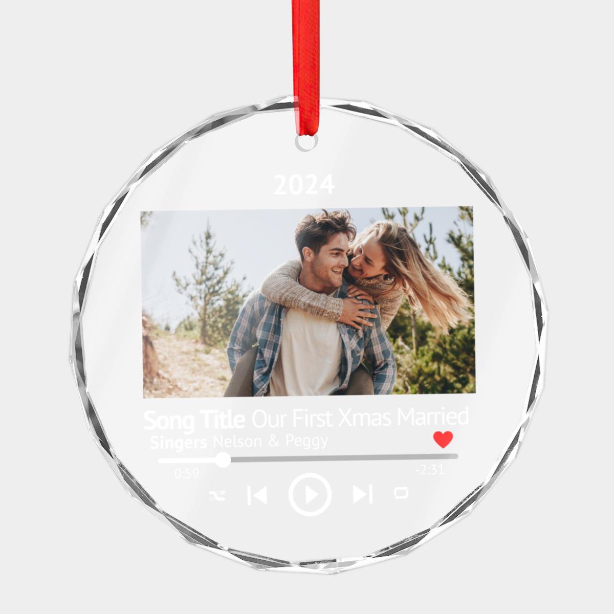 Explore the perfect newlywed gift with this exquisite crystal glass photo ornament, featuring a couple in an outdoor setting and a music player design. Adorned with "Song Title: Our First Xmas Married" and "Singers: Nelson & Peggy," this personalized keepsake captures your cherished moment beautifully.
